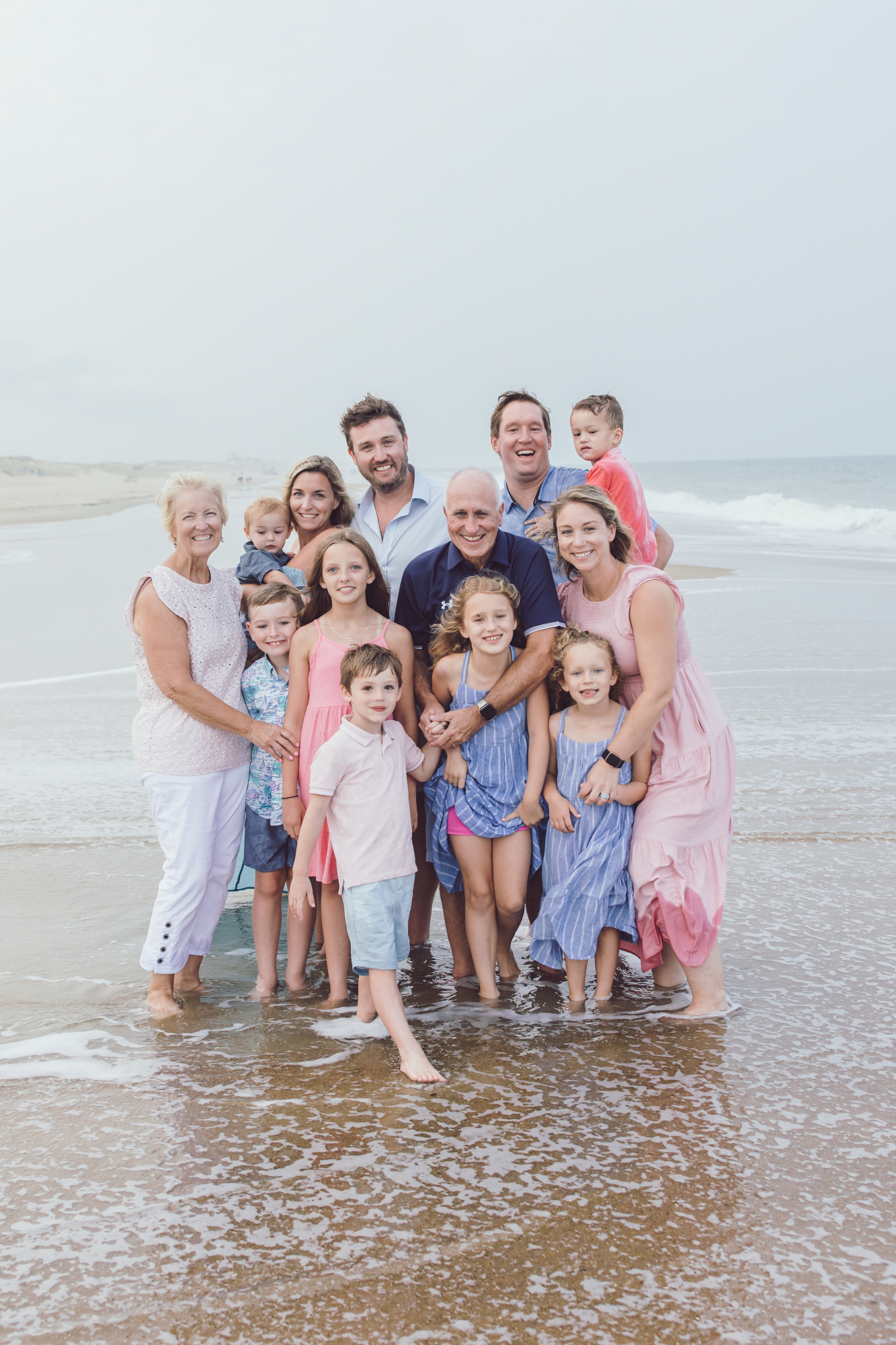 Family laughing together on Dewey Beach