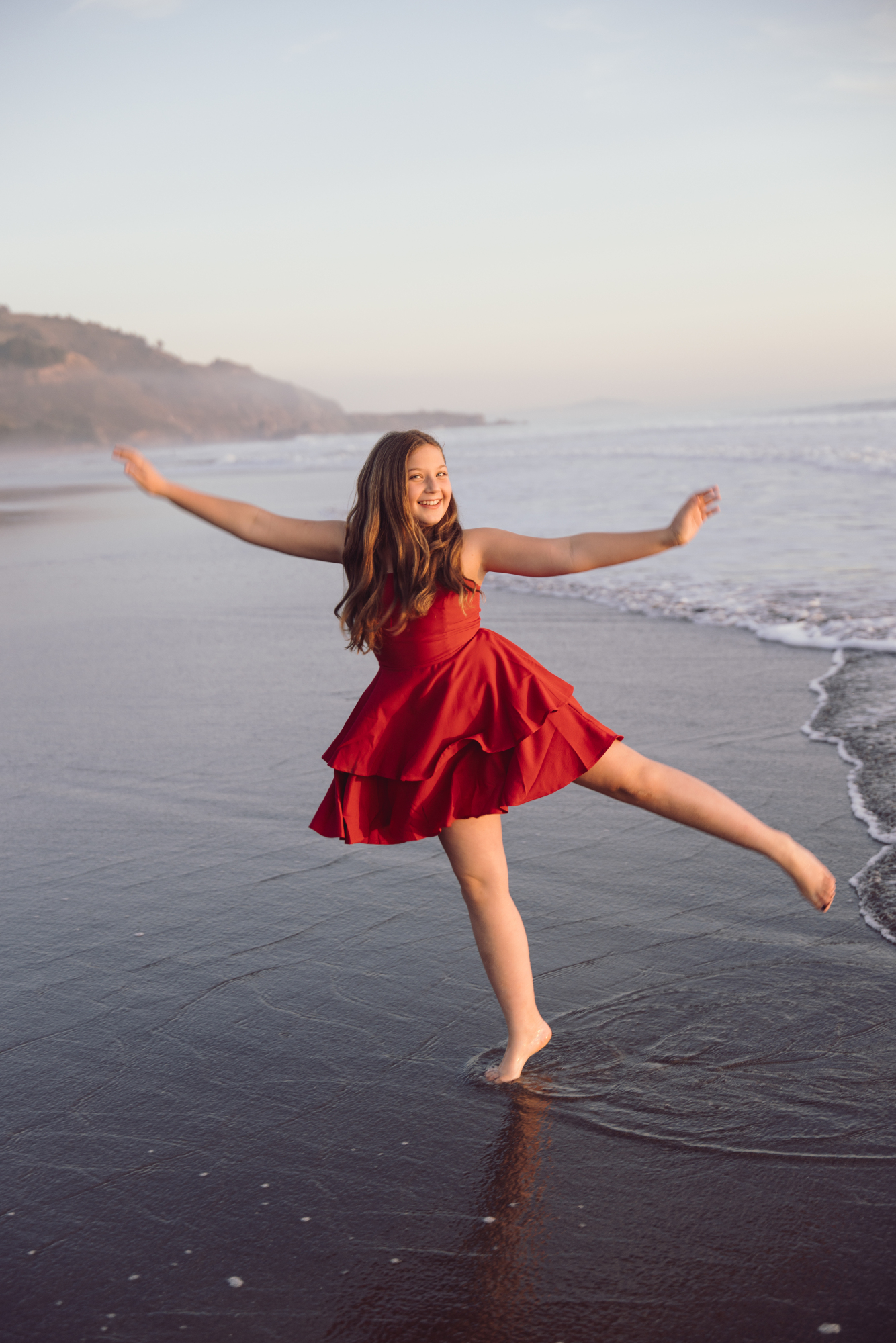Playful ocean portrait during Dewey Beach session