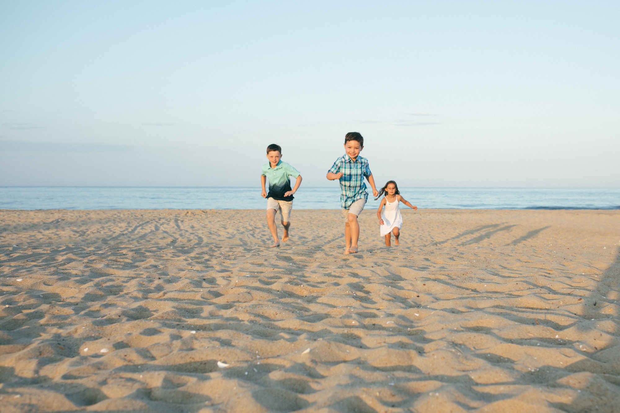 Family at sunset on Dewey Beach Delaware